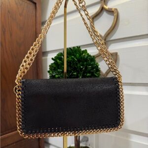 Stella McCarthy Stylish Black and Gold Women's Clutch and cross body